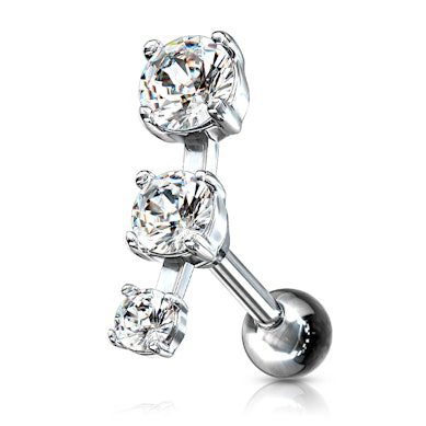 Piercing do ucha se třemi kamínky v řadě